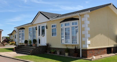 Fancy residential mobile home on beautiful property. Mobile Home Insurance Claims.