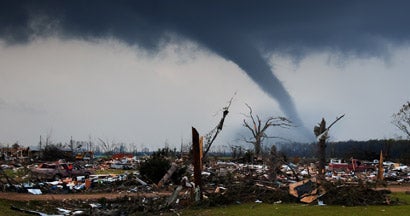 A tornado on the ground shortly after destroying a small neighborhood.